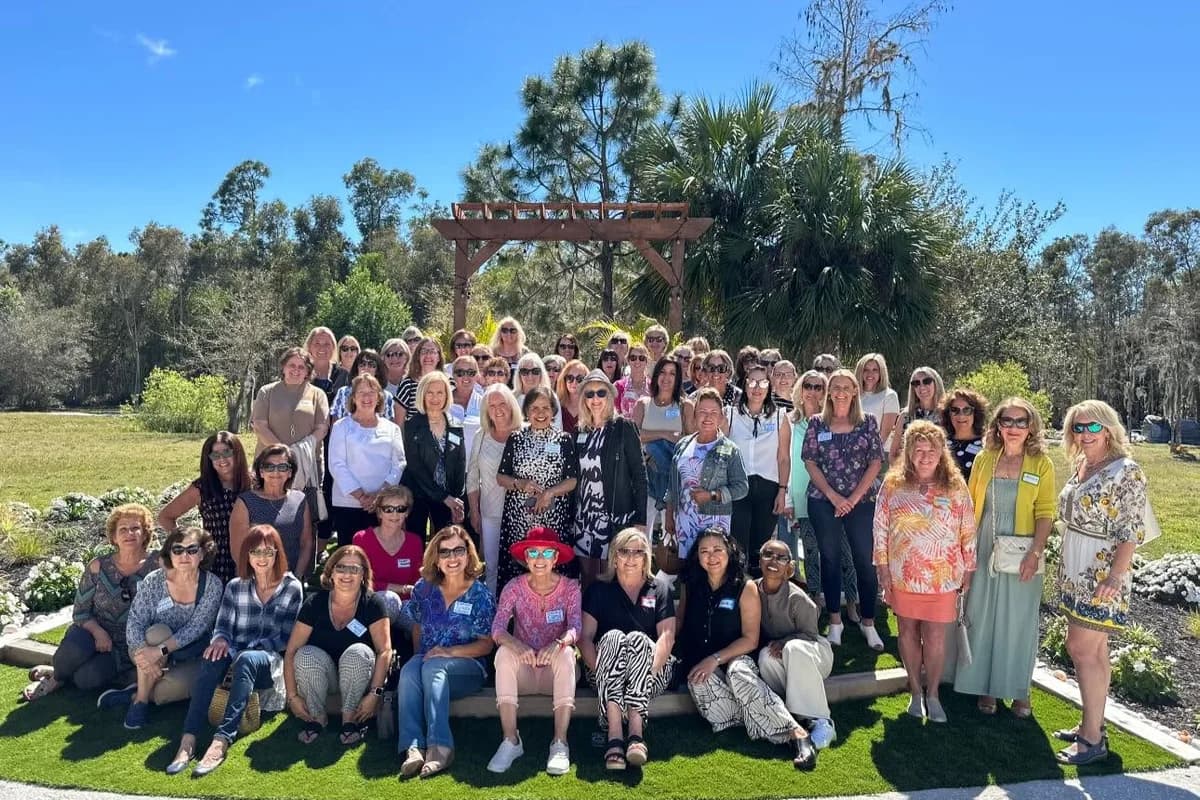A large group of WildBlue neighbors gathered together at an outdoor luncheon
