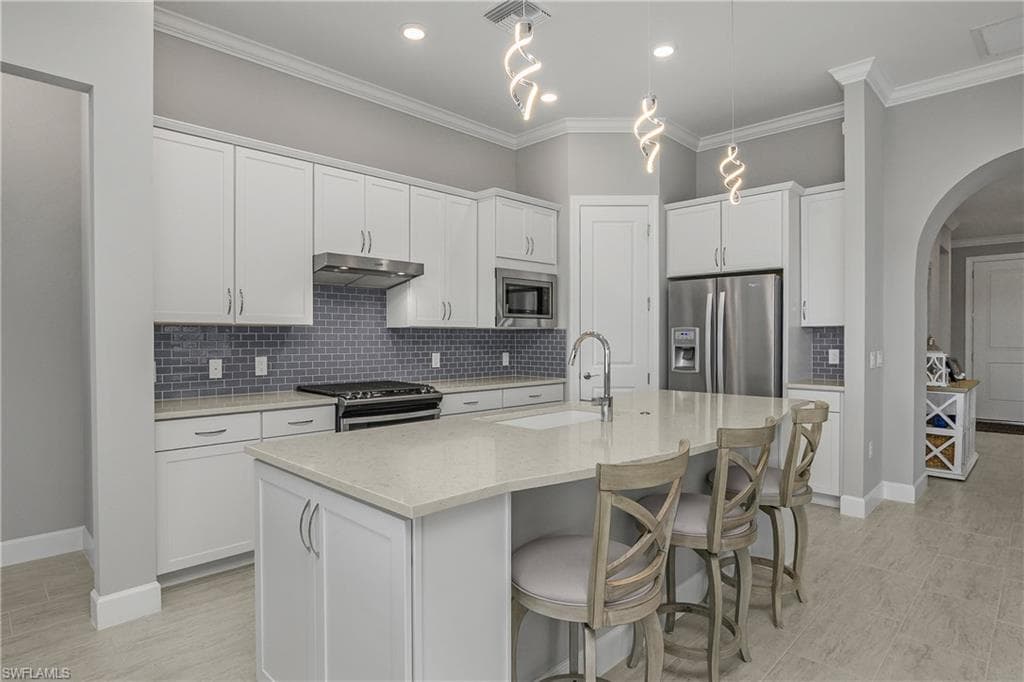 White kitchen with large island